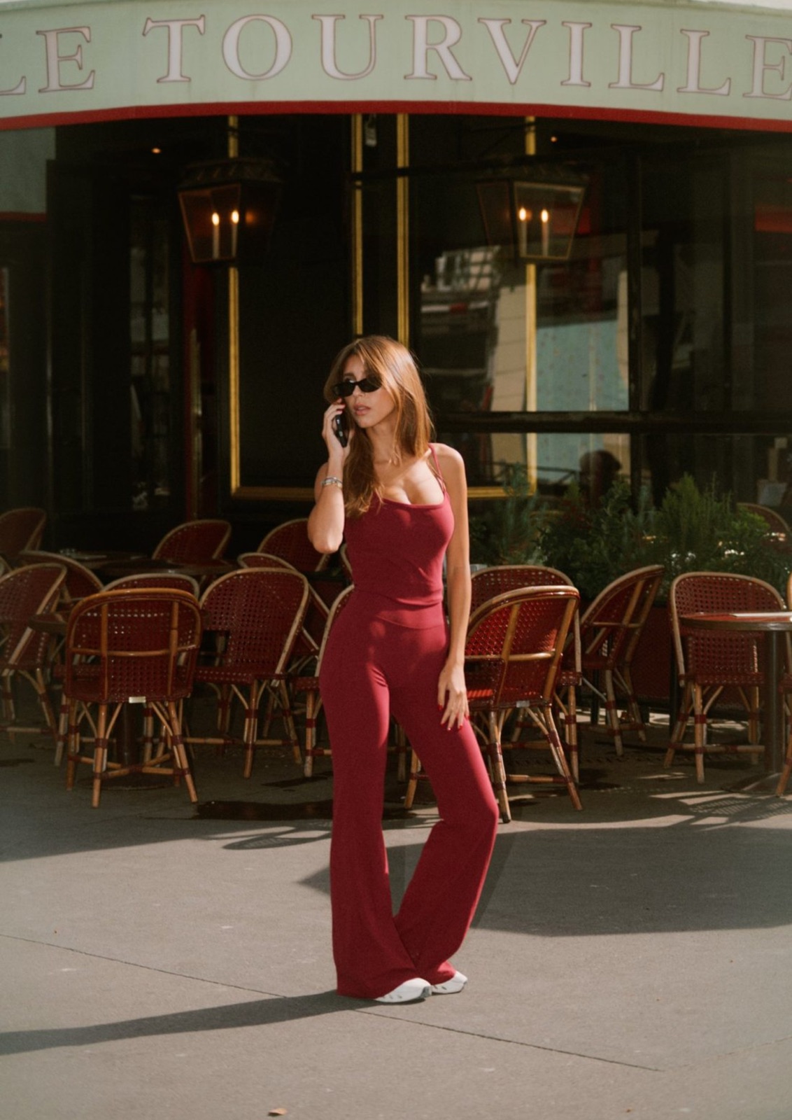 Model in the Cherry set outside a Paris café